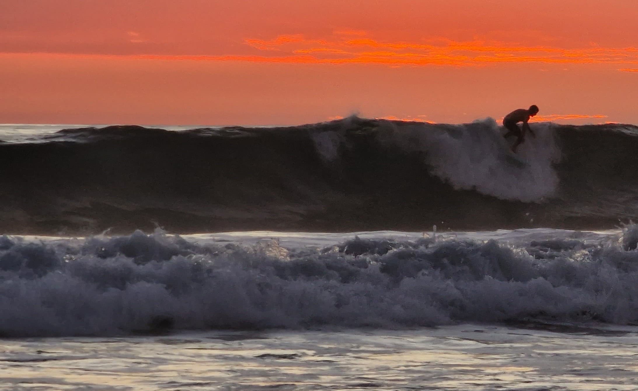 Surfer catching a wave on the Costa Rica coast