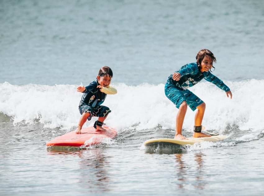 First-time surfer standing up on a wave in Costa Rica
